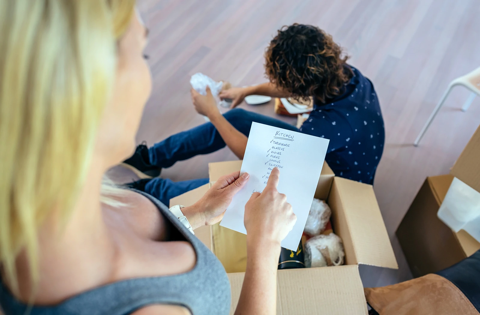 Woman looking at moving checklist